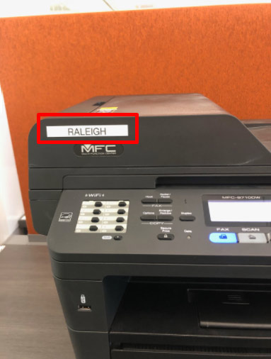 A printer with a red box around the name of the printer