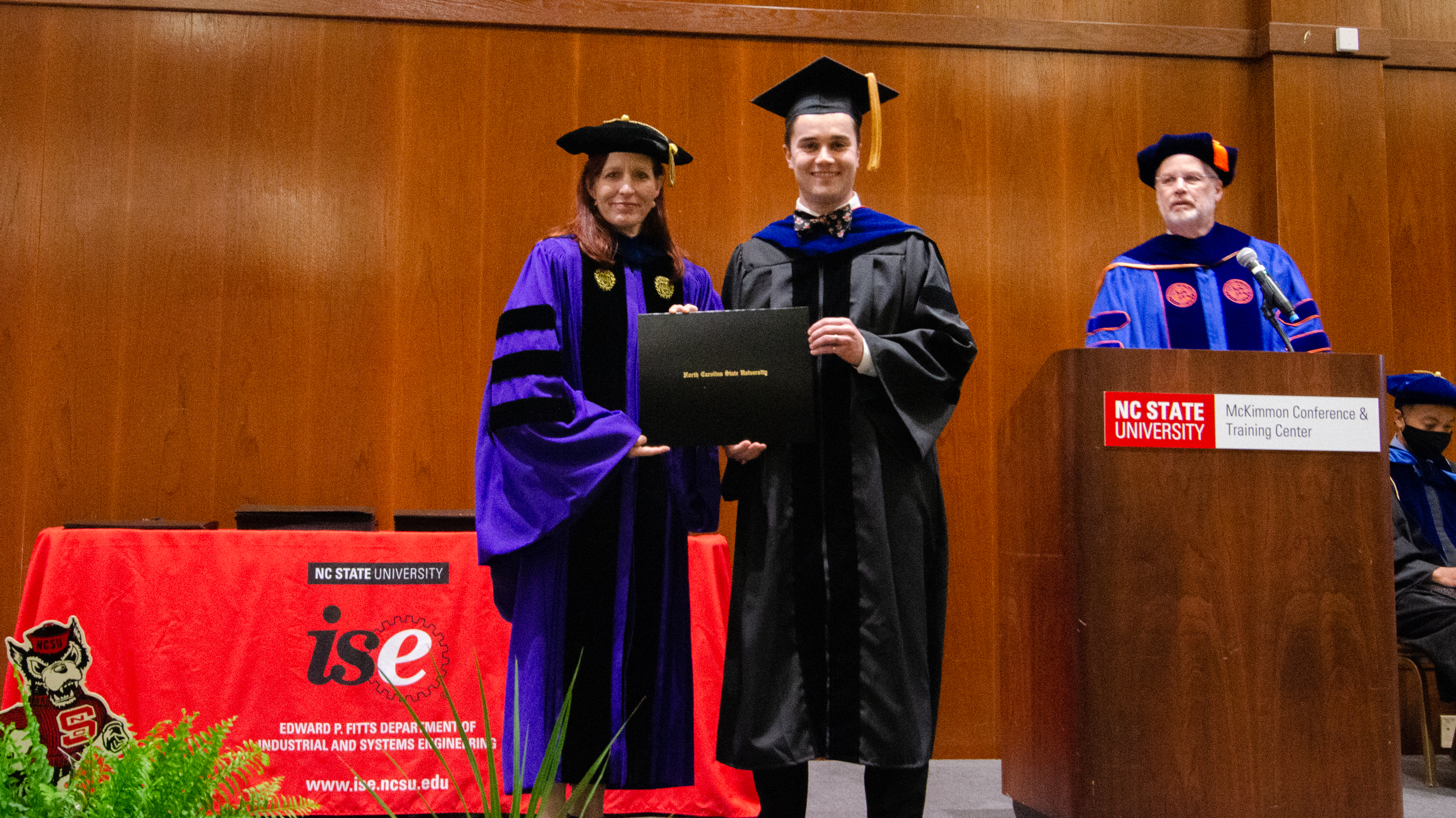 Gregory Hauser receiving his diploma