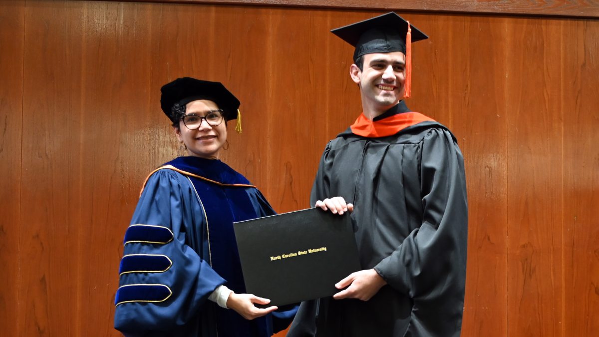 Evan receives his Master of Operations Research from Maria Mayorga