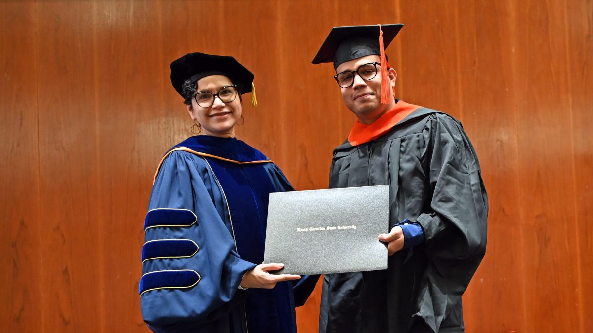 Francisco receives his Master of Operations Research from Maria Mayorga