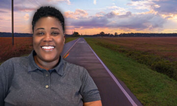 Tammy Montgomery standing in front of the rural highway