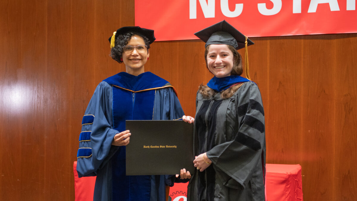 Ph.D. student Demetra Protogyrou receives her degree from OR Director Maria Mayorga.