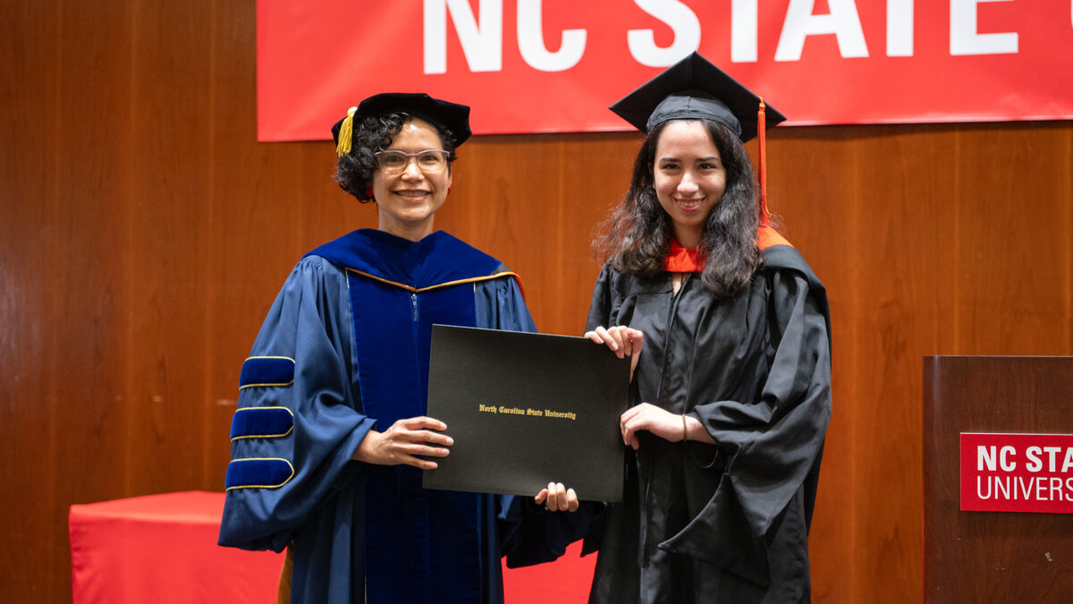 MOR student Mehr Salami receives her degree from OR Director Maria Mayorga.