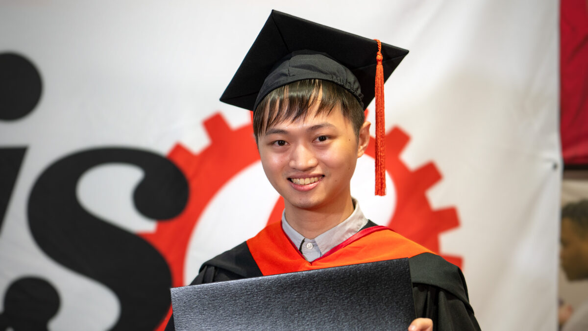 MOR student Hou-An Chen poses with his new degree.