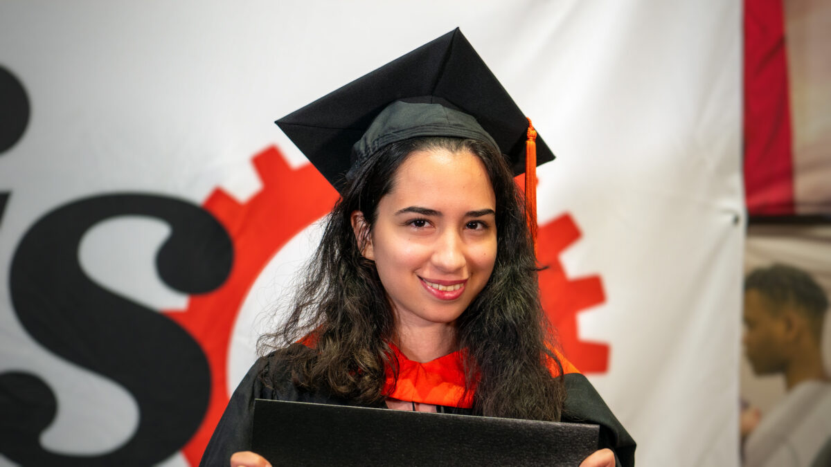 MOR student Mehr Salami poses with her new degree.